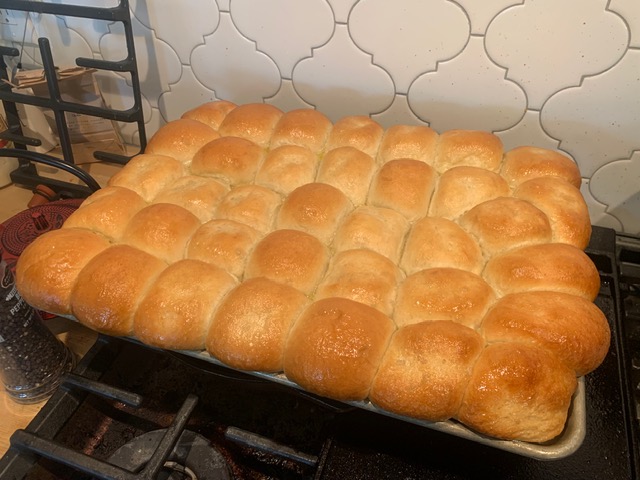 Golden pull-apart dinner rolls fresh from the oven