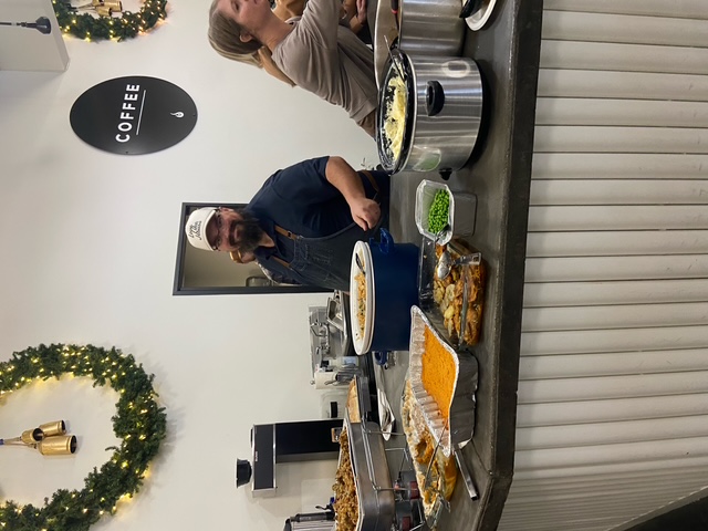Mike serving a holiday buffet line